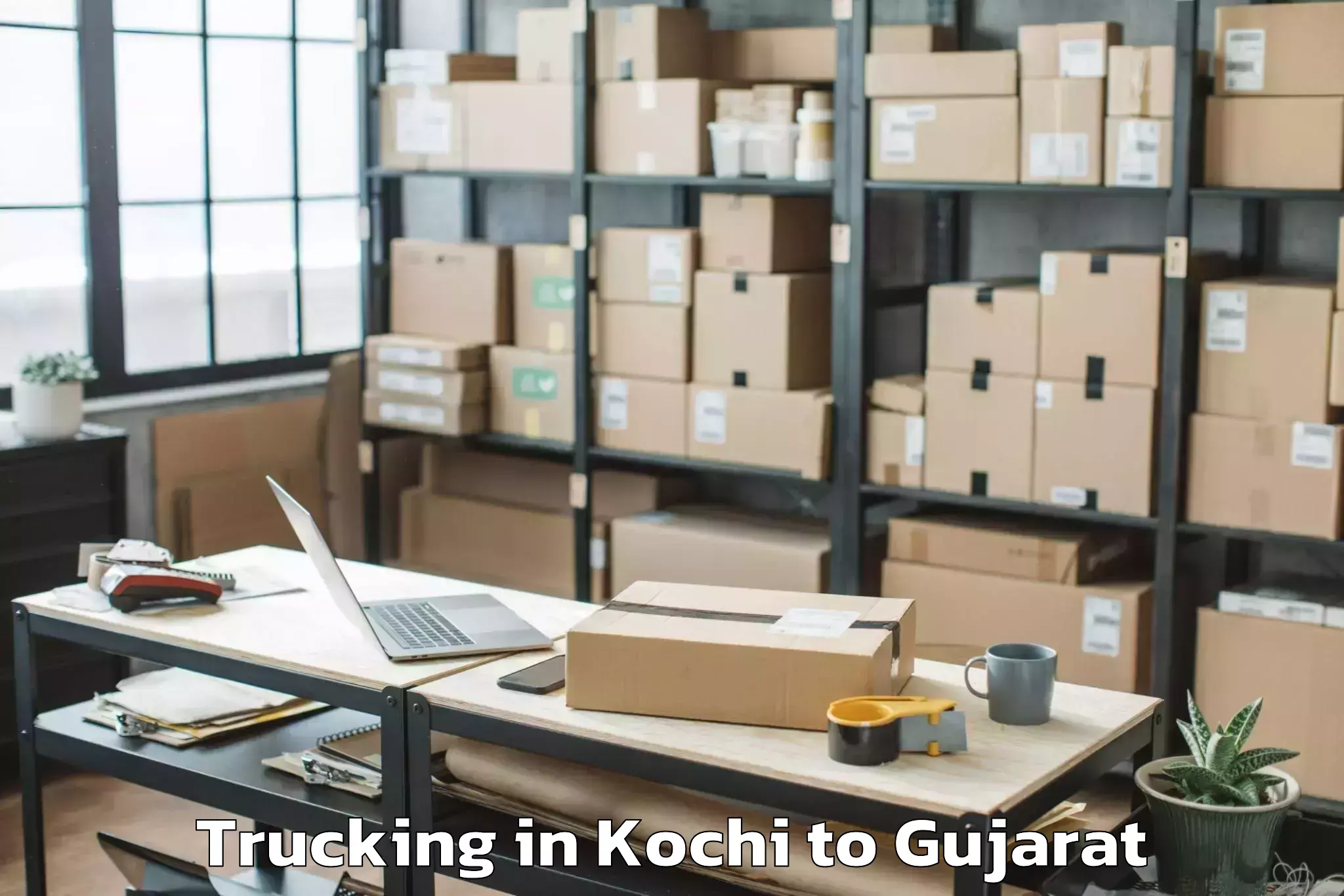 Book Kochi to Garbada Trucking